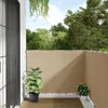 A balcony with a beige privacy screen, wooden floor, and potted plants. Produktbild-Vorschau