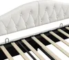 A close-up view of the headboard and slatted base of a white upholstered bed frame. Náhled obrázku produktu