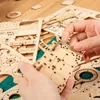 Hands assembling a wooden 3D puzzle. Náhľad obrázku produktu