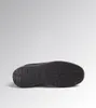 The bottom view of a black safety shoe with yellow accents against a light gray background. Produktbild-Vorschau