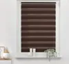 A window with brown and tan striped roller blinds. Produktbild-Vorschau