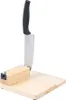 A knife is inserted into a wooden block on a wooden base. Náhled obrázku produktu