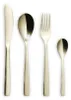 A set of four champagne-colored cutlery pieces arranged in a row against a white background. Produktbild-Vorschau
