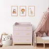 A nursery room with a pink changing table, a bed with a pink canopy, and framed animal pictures on the wall. Podgląd zdjęcia produktu