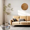 A living room scene with a sofa, a decorative basket, and a plant. Produktbild-Vorschau