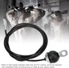 A gym cable wire is shown in the foreground, with a blurred background of a muscular man performing a bicep curl exercise. Podgląd zdjęcia produktu