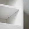 Close-up view of the interior of a white shelf unit, showing shelf supports and pre-drilled holes. Anteprima dell’immagine prodotto