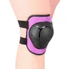 A close-up of a purple knee pad with a black protective shell, worn on a leg. Produktbild-Vorschau
