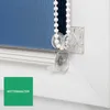 A close-up view of a roller blind mechanism, showing the chain and its holder. Produktbild-Vorschau