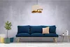 A modern living room scene with a blue sofa, a pendant lamp, and a small table. Produktbild-Vorschau