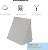 A wedge pillow with icons and text describing its features. Produktbild-Vorschau