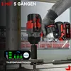 A person is holding a cordless impact wrench in a construction or industrial setting. Voir les images du produit