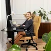 A woman is working at a desk in a home office setting. Náhľad obrázku produktu