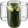 Three glass jars, one filled with pickles and brine, and two empty, are arranged on a white background. Podgląd zdjęcia produktu