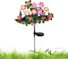 A solar-powered decorative flower light in a garden setting. Náhled obrázku produktu