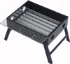 A black portable folding charcoal grill with a silver grate. Produktbild-Vorschau