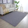 A living room scene with a sofa, rug, and plant. Produktbild-Vorschau