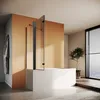 A modern bathroom with a bathtub and a glass shower screen. Produktbild-Vorschau