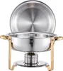 A stainless steel chafing dish with gold handles and legs, shown with its lid open. Produktbild-Vorschau