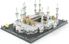 A detailed architectural model of the Grand Mosque of Mecca, likely a building block set, displayed on a gray base with a white background. Produktbild-Vorschau