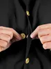 A close-up shot of a person's hands buttoning a black garment with gold buttons. Anteprima dell’immagine prodotto
