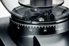 A close-up of a coffee grinder's adjustment ring and hopper. Podgląd zdjęcia produktu