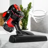 A cordless vacuum cleaner is shown in a home setting, with a plant and sofa in the background. A graphic of a tornado is overlaid on the image. Podgląd zdjęcia produktu