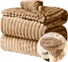 A folded blanket with a ribbed texture. Produktbild-Vorschau