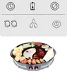 A top-down view of a dual-purpose electric grill and hot pot, filled with various food items, set against a light gray and white background with icons above. Voir les images du produit