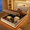 A modern bedroom with a hydraulic lift storage bed, showcasing the open storage compartment filled with various items. Produktbild-Vorschau
