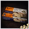 Kandylas Halva mit Pistazien 200 g Verpackung auf dunklem Holz mit Pistazien Produktbild-Vorschau