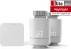 Two smart thermostats and a central hub are displayed against a white background. Náhľad obrázku produktu