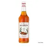 A bottle of Monin Cinnamon syrup against a white background. Podgląd zdjęcia produktu