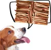 A dog looking up at a speech bubble filled with dog treats. Produktbild-Vorschau