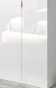 A close-up view of a white, high-gloss wardrobe door with a reflection of furniture. Produktbild-Vorschau