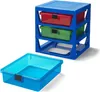 A blue plastic storage unit with three drawers (one red, one green, and one transparent blue) is shown next to a separate transparent blue drawer. Podgląd zdjęcia produktu