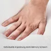 A hand pressing into a white, soft material, likely a pillow or mattress, demonstrating its cushioning properties. Produktbild-Vorschau