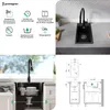 A collage of images showing a black granite kitchen sink with a faucet, installation instructions, and technical diagrams. Produktbild-Vorschau
