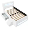 A white upholstered twin bed frame with integrated storage and LED lighting. Produktbild-Vorschau
