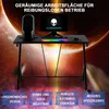 A gaming desk setup with a computer, monitor, and keyboard, set against a cosmic background. Produktbild-Vorschau