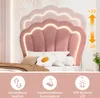 A pink upholstered bed with a scalloped headboard featuring LED lighting, shown with pillows and bedding. Produktbild-Vorschau