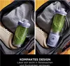 A blender bottle filled with a green smoothie is placed inside a gym bag next to a pair of sneakers. The image is split into two halves, showing the blender from slightly different angles and highlighting its compact design for travel. Náhled obrázku produktu