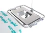 A close-up of a silver ironing board attachment with a white pad with text on it. Produktbild-Vorschau
