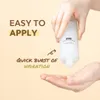A hand is pouring a white liquid from a bottle into another hand. Produktbild-Vorschau