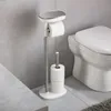 A toilet paper stand with two rolls of toilet paper next to a toilet in a bathroom. Voir les images du produit