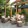 A couple relaxing on a patio furniture set under a wooden pergola in a garden. Náhľad obrázku produktu