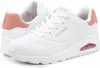 A pair of white Skechers sports shoes with pink accents. Produktbild-Vorschau