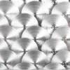 A close-up, abstract view of brushed metal circles with concentric rings, creating a textured, metallic pattern. Produktbild-Vorschau