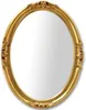 A studio shot of an oval mirror with a decorative gold frame. Anteprima dell’immagine prodotto