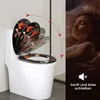 A toilet seat with a floral design is shown on a toilet, with an illustration of its slow-closing mechanism. To the right, a child sleeps peacefully in bed, implying the quiet operation of the toilet seat. Produktbild-Vorschau
